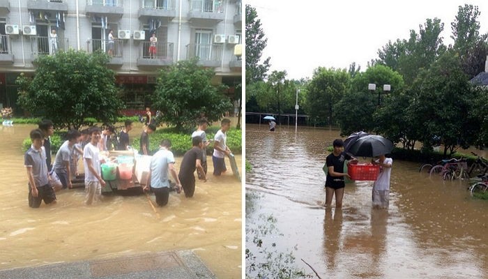 홍수로 갇힌 여학생들 위해 비 뚫고 ‘밥’ 나른 남학생들 (사진)