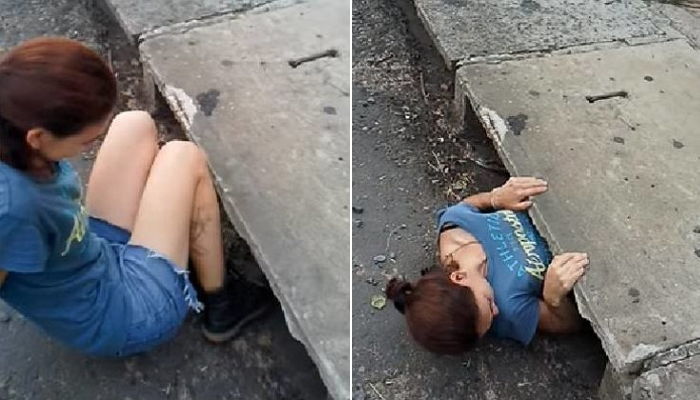 길 가던 여성이 좁고 악취 나는 ‘배수구’로 몸을 구겨 넣은 이유