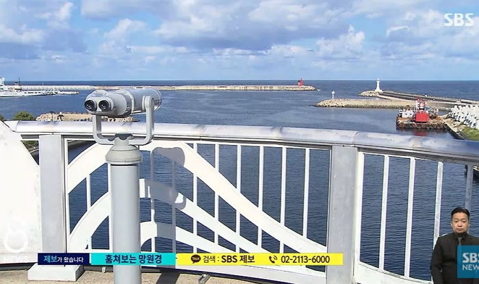 “호텔 객실 안이 훤히 보여요”...속초 설악대교에 설치된 관광 망원경 논란