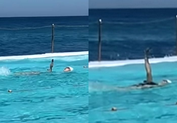 배영하며 물 밖으로 손 내민 여성... ‘스마트폰 중독’ 끝판왕 포착됐다 (영상)