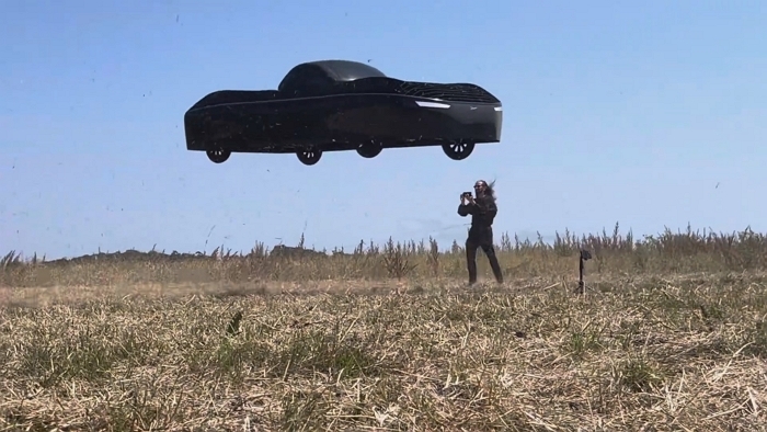 Jim Dukhovny CEO of Alef near the flying car during a flight test.jpg