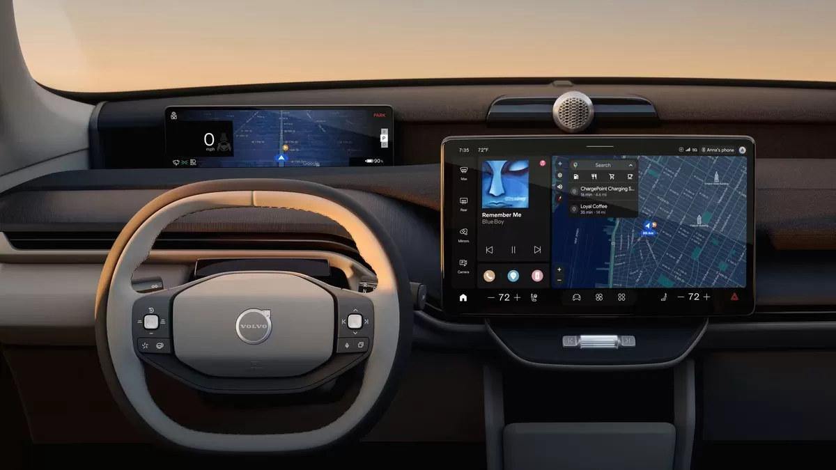 The dashboard of the Volvo EX60 showing the steering wheel, driver display and center display.
